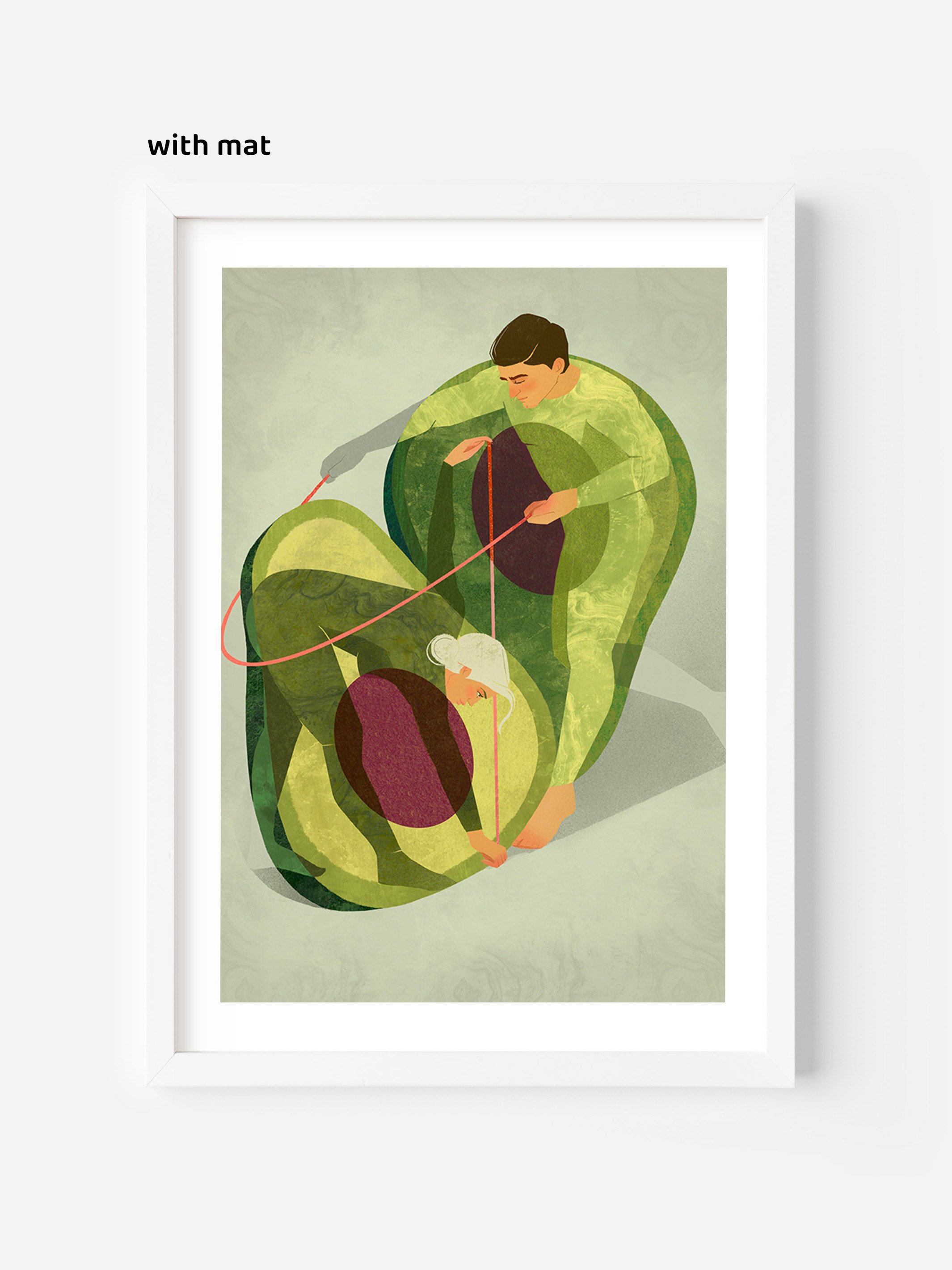 Framed wall art with white mat, showing a playful avocado illustration with two people measuring each other inside the fruit.