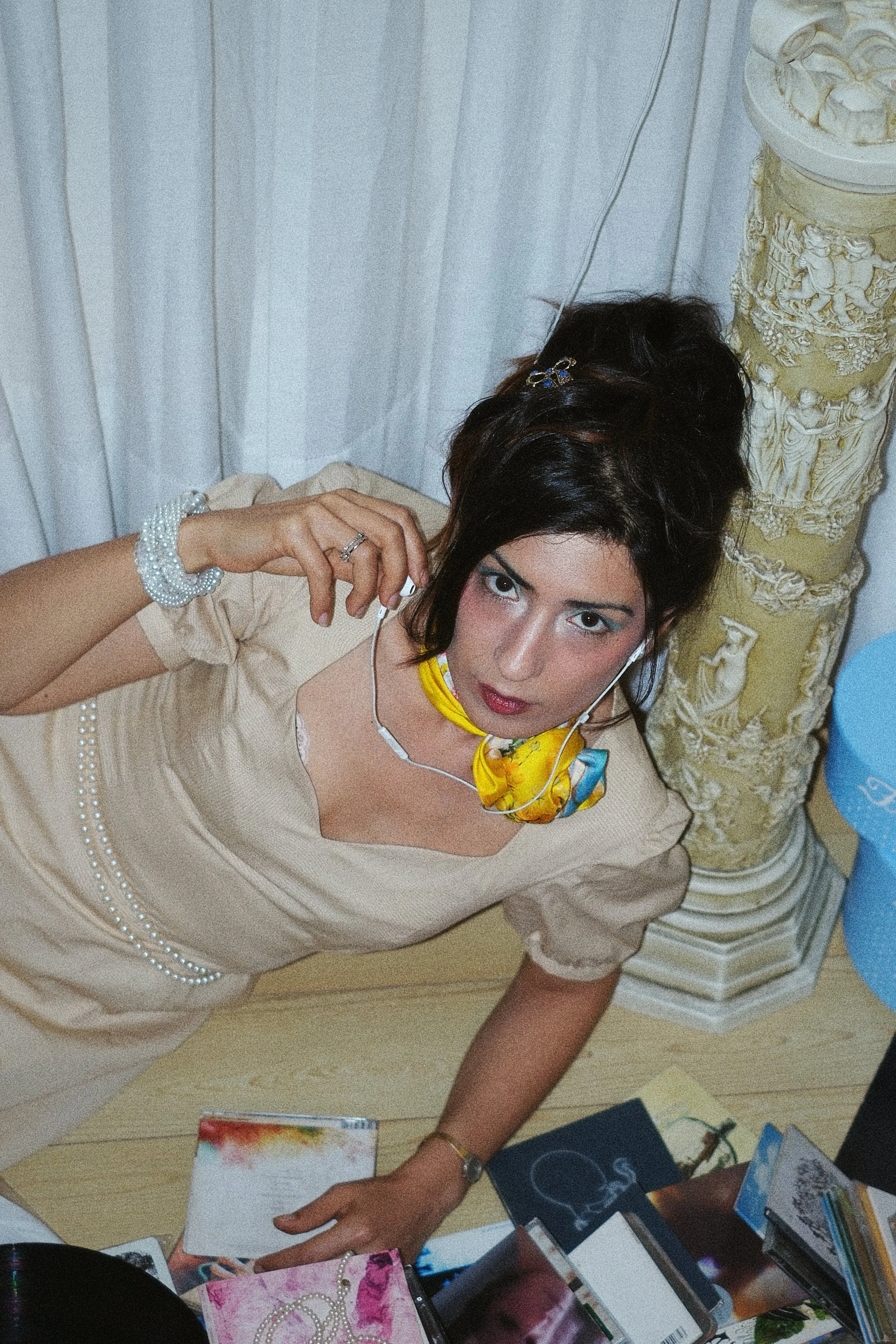 Model posing in Pacha Dress surrounded by CD's.