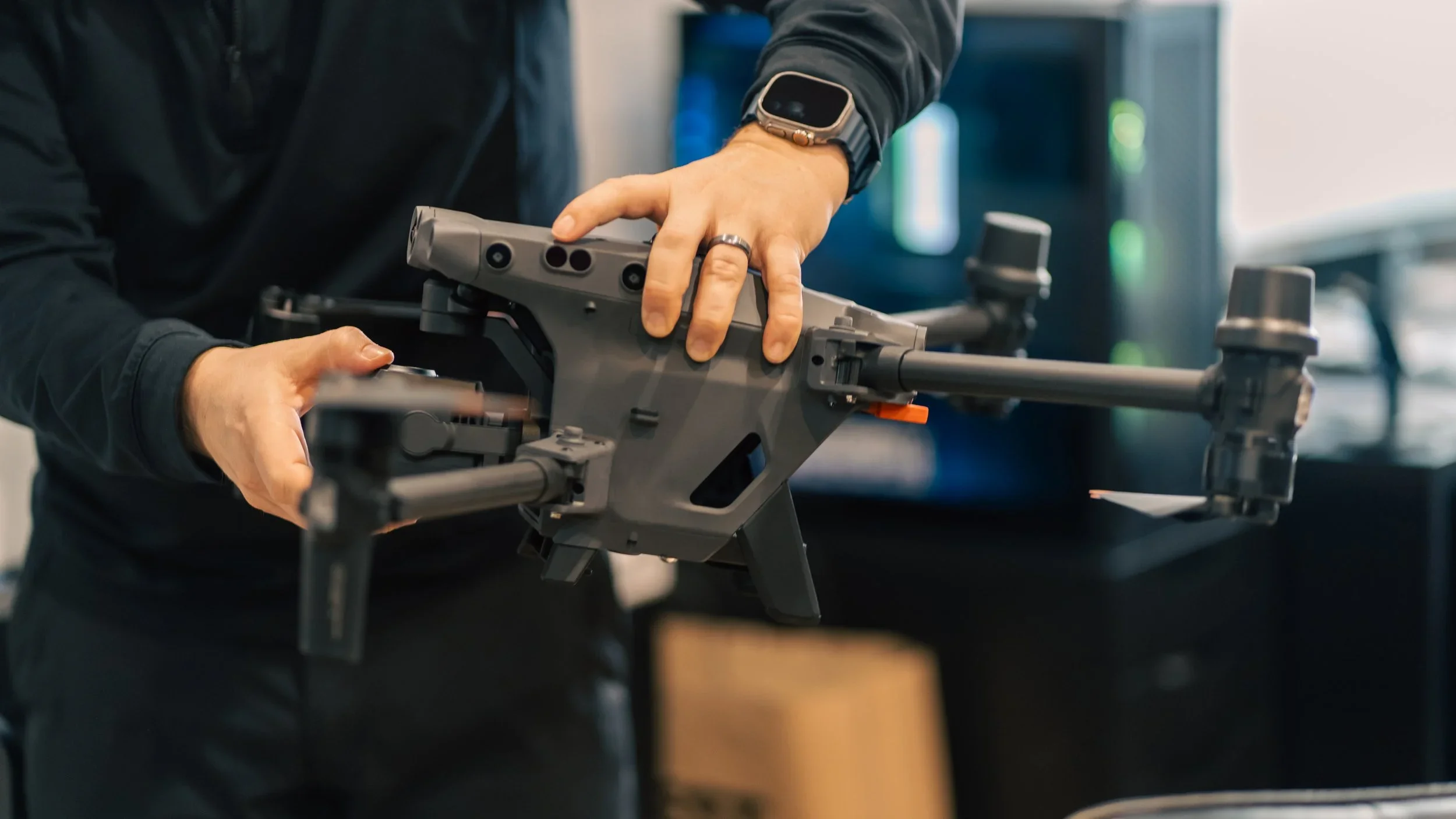 Staff member holding advanced drone