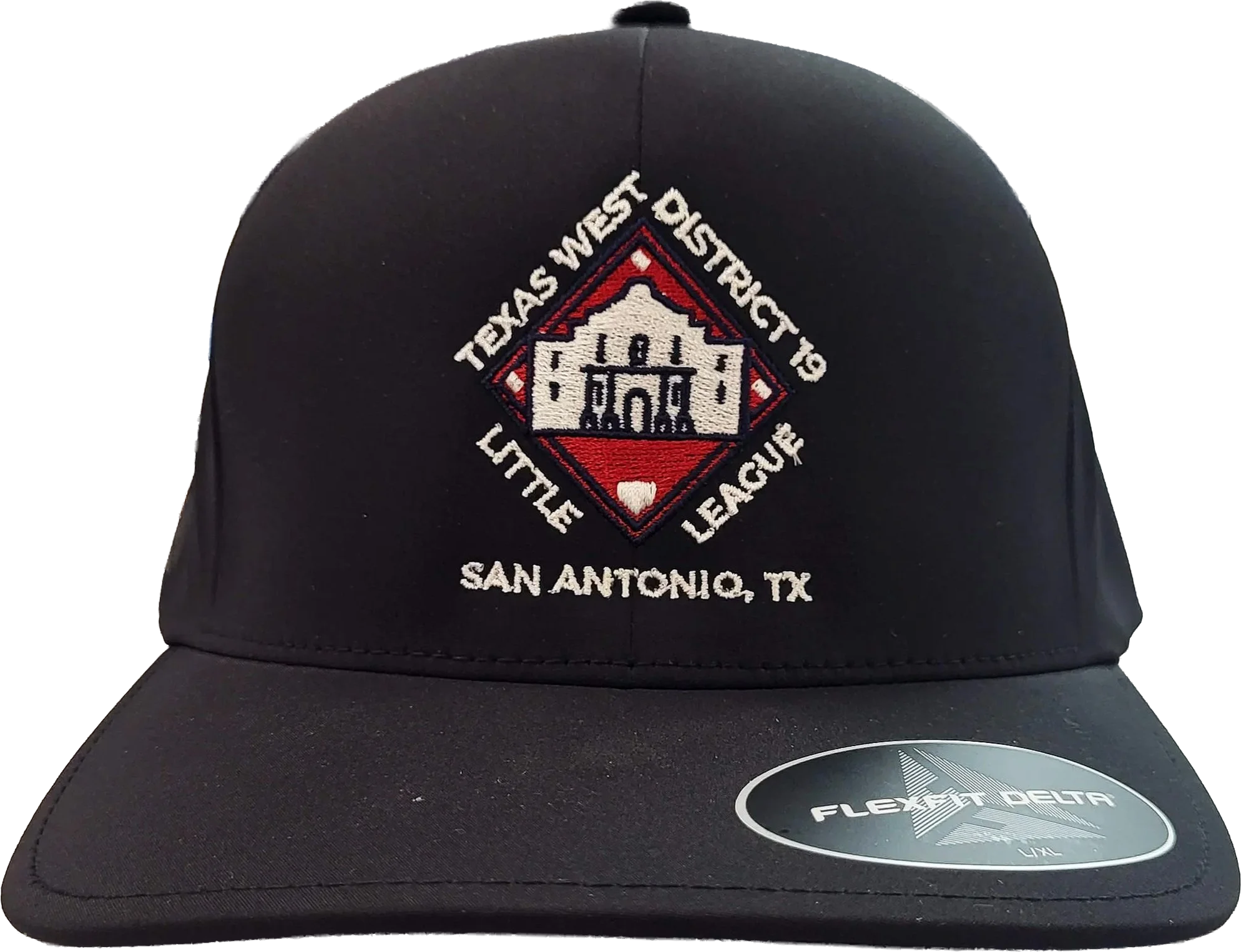 A black baseball cap featuring a patch with the text "Texas West District 19 Little League," an embroidered image of the Alamo, and the location "San Antonio, TX." The cap also has a sticker from Flexfit Delta size L/XL on the brim.