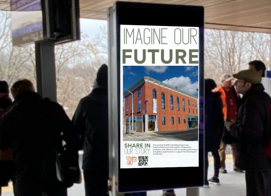 Outdoor display with "Imagine Our Future" poster, featuring an image of a modern brick building and people gathered around in a public area.