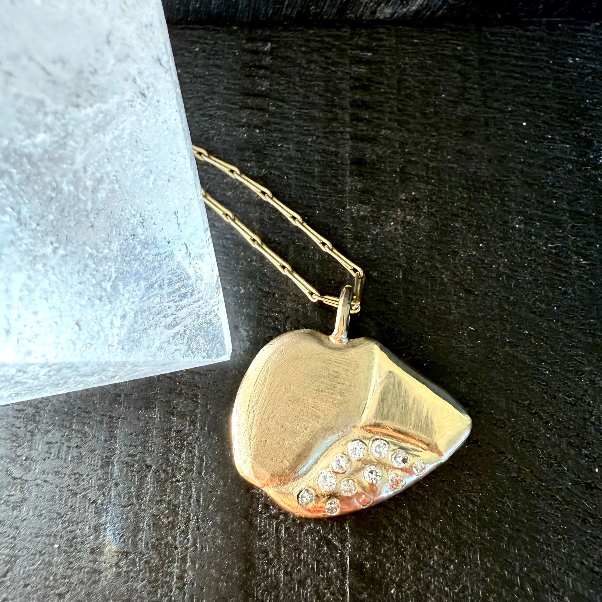 For Louie, the sweetest. A pendant inspired by the patch on his eye. Inlay of ashes in the back. 