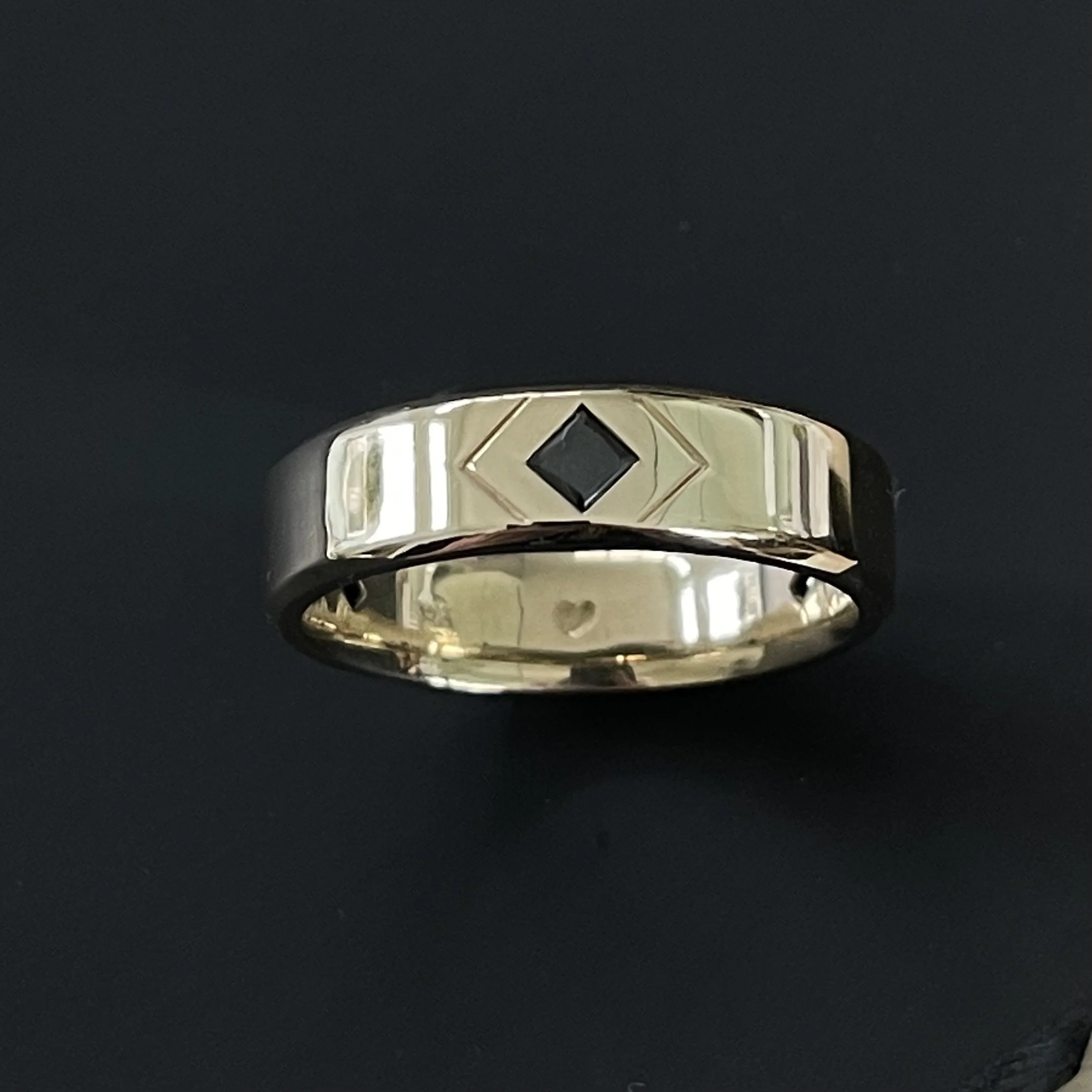 14K yellow gold with black diamond.