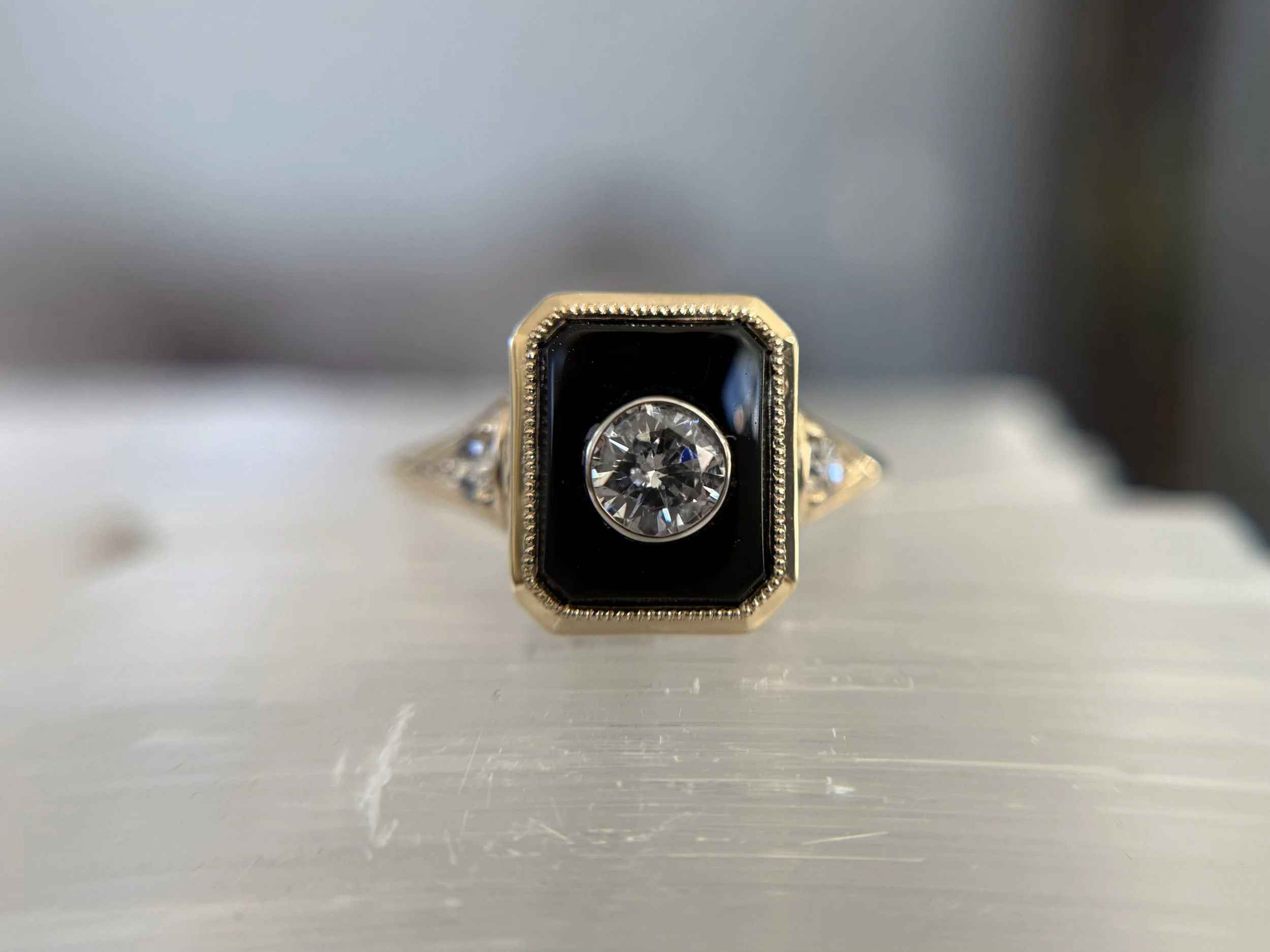 A memorial piece with inlay of ashes on the inside of the ring. !4k, onyx, diamond. 