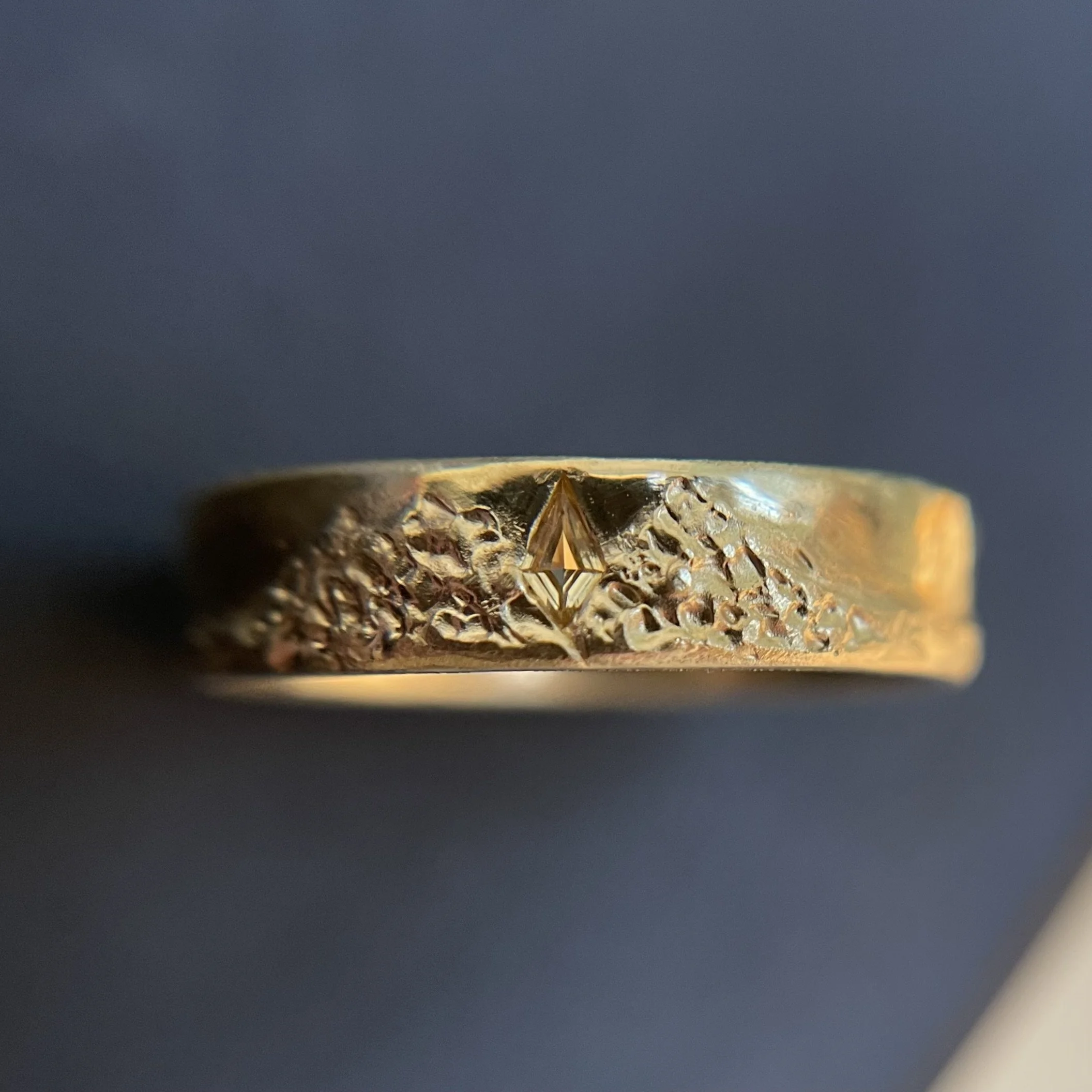 18K yellow gold band with yellow sapphire.