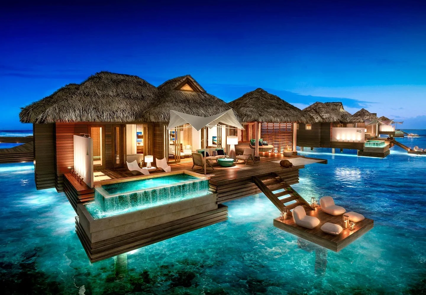 Luxury overwater bungalow with a private infinity pool, sun deck, and direct ocean access at Sandals Royal Caribbean in Jamaica