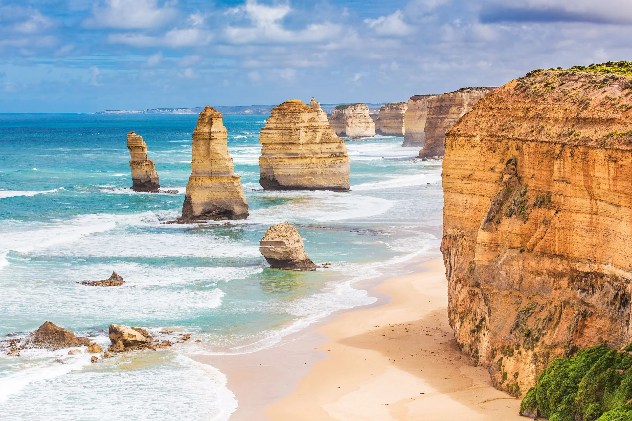 Twelve Apostles limestone formations rising from the ocean along Australia’s Great Ocean Road.