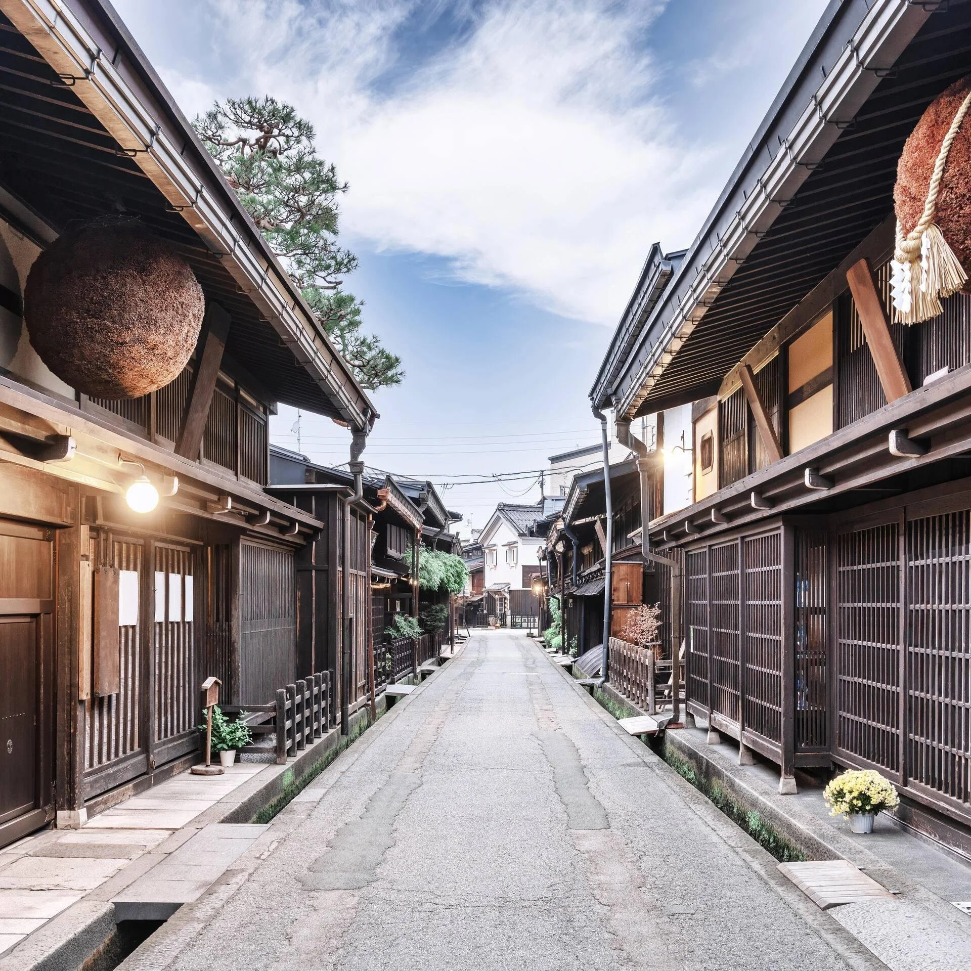 Traditional wooden merchant houses lining a preserved street in Takayama’s historic old town.