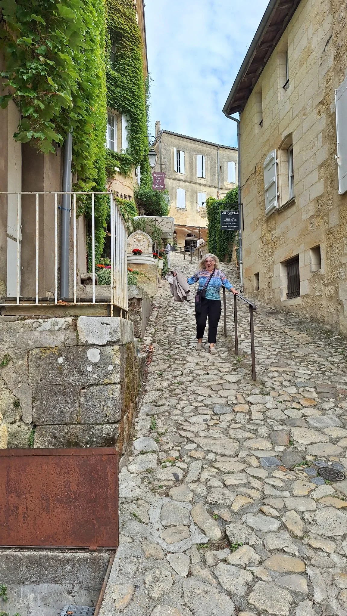 Linda walking down the stone street.jpeg