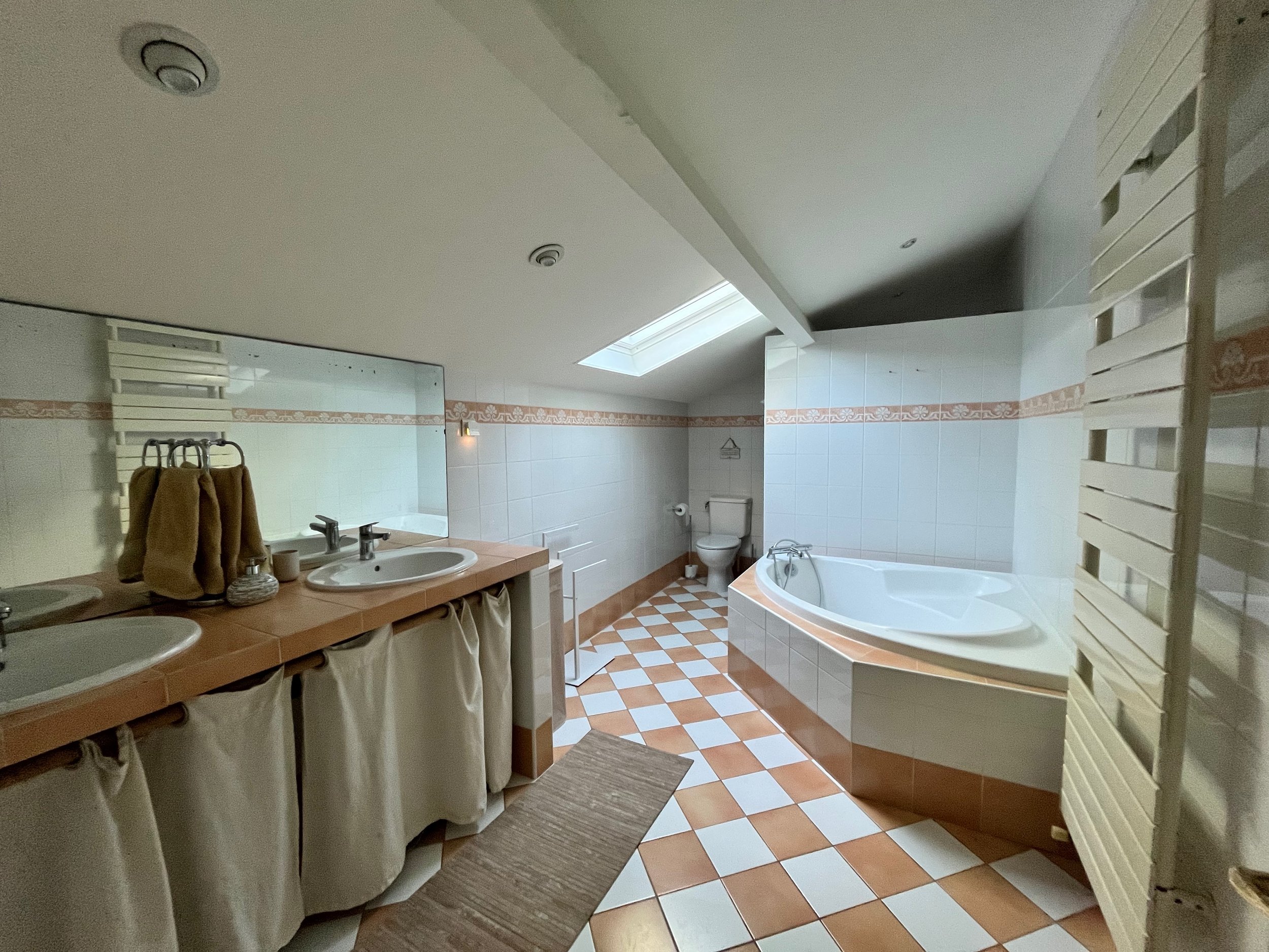 Shared bathroom with both a shower and a bathtub