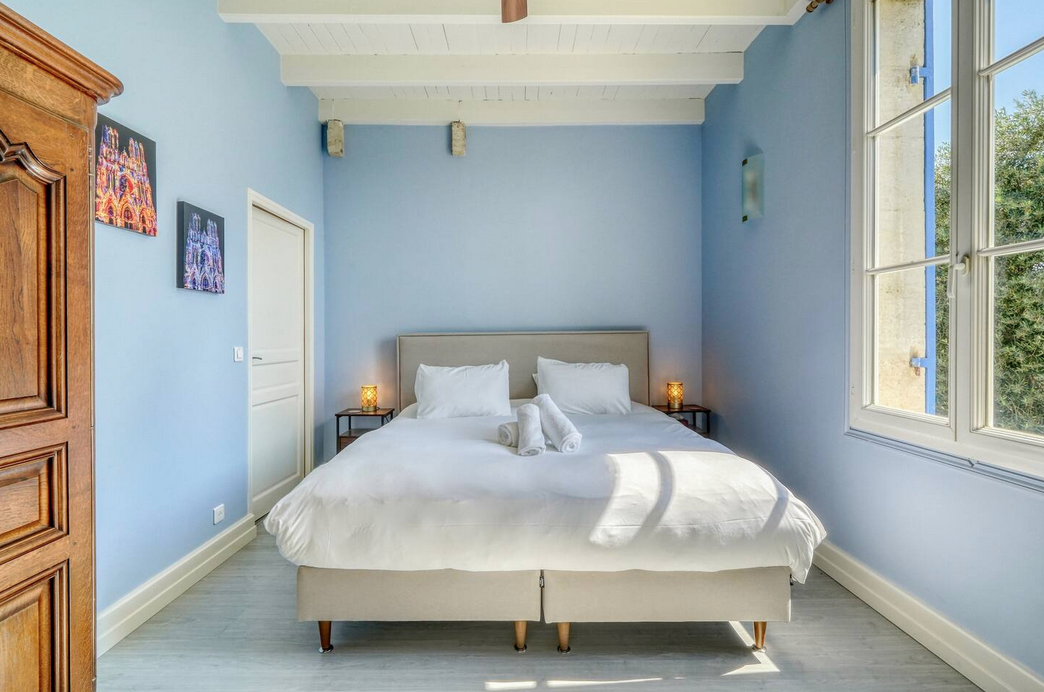 1st bedroom with king-sized bed and ensuite bathroom