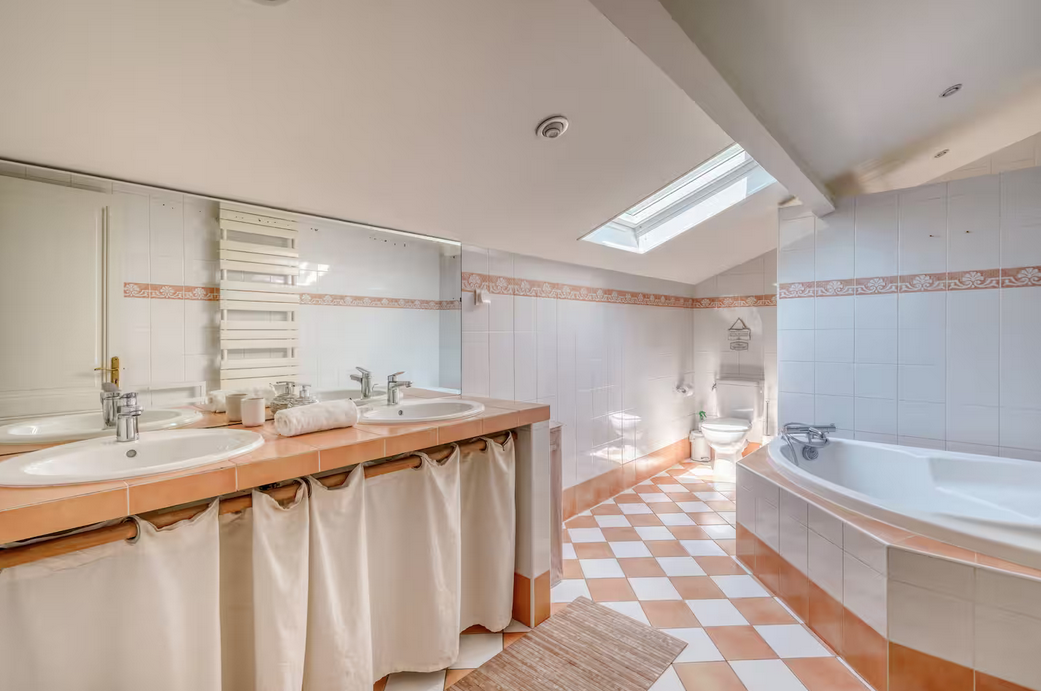 Shared bathroom with both a shower and a bathtub
