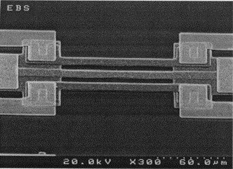 Close-up of an electronic circuit with metallic connections at high magnification.