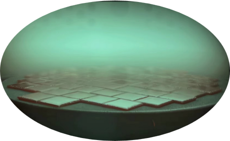 A large, flat table-like structure with square tiles on top, illuminated by a soft, greenish light, with an arched backdrop