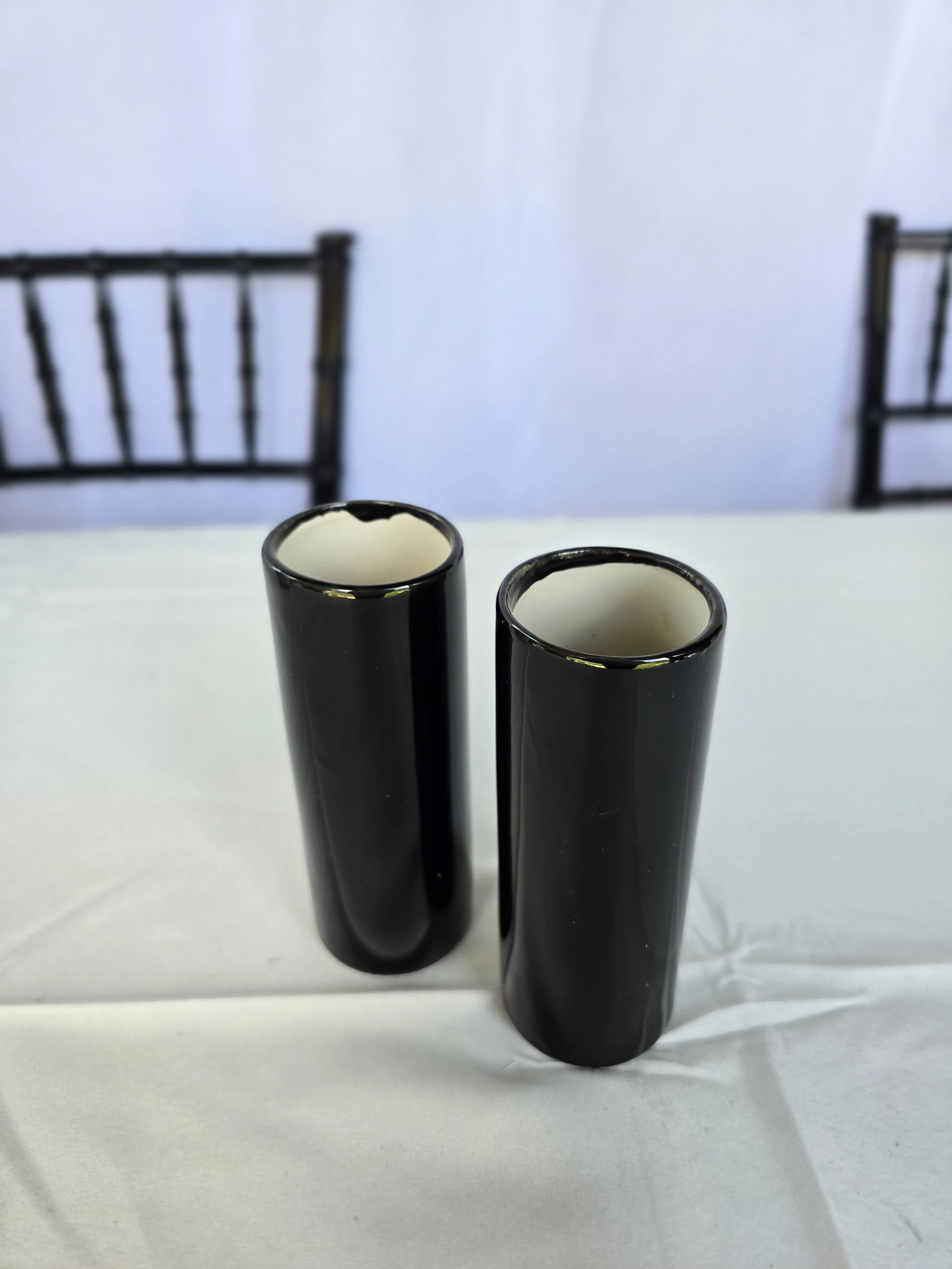 Small black cylinder vases