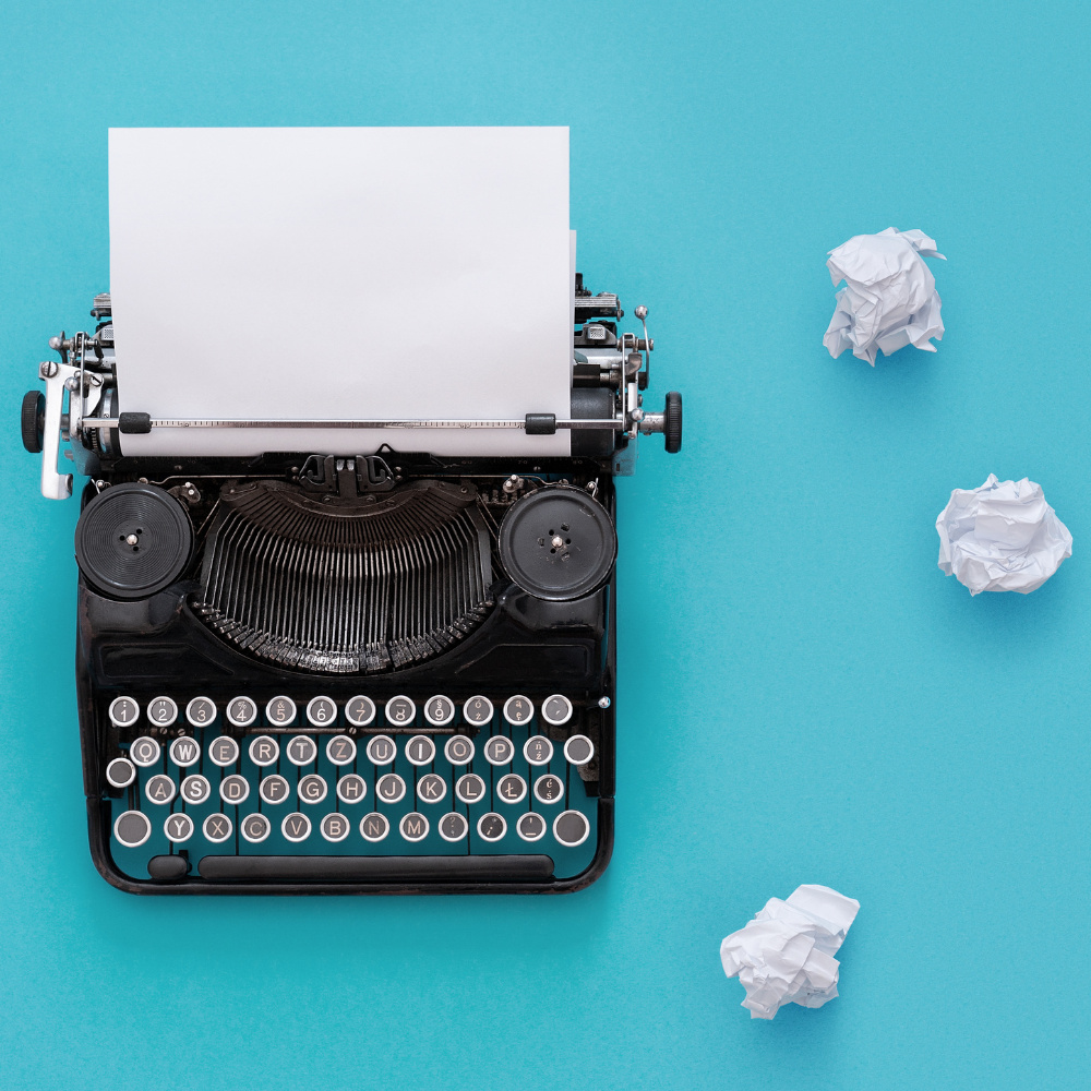Typewriter on blue background