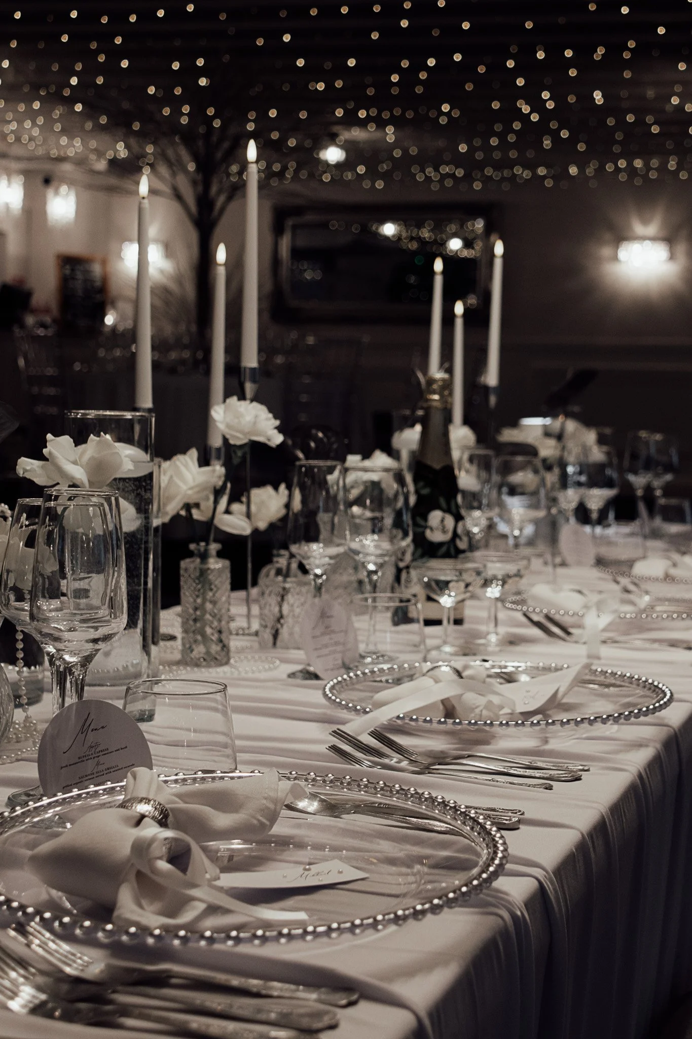 Elegant wedding table styling with candles and glassware at The Orchard wedding venue in Kent.