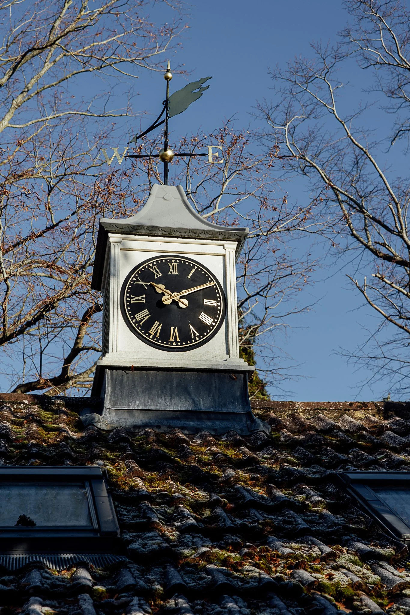Exterior detail of historic clock at Byre Barn wedding venue in Kent