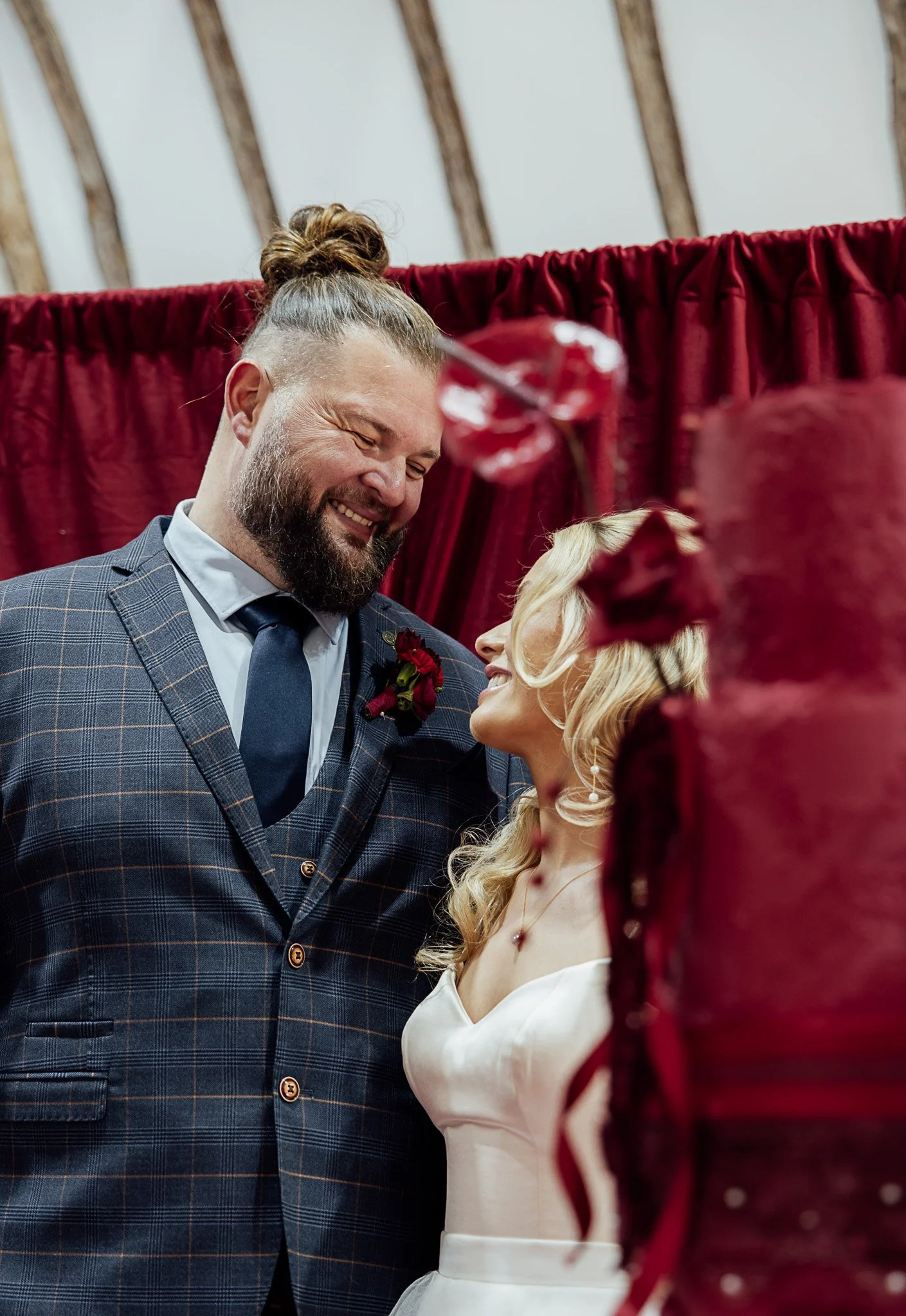 Bride and groom laughing together during intimate portrait at Byre Barn Kent