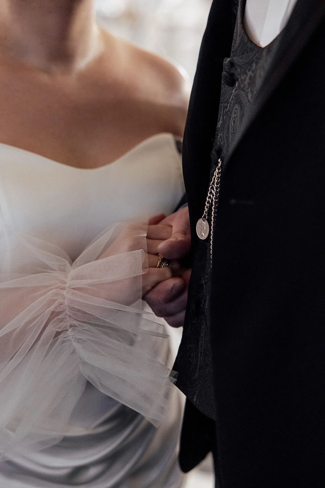 Modern bridal dress detail with soft tulle sleeves styled for a romantic wedding shoot in Kent.
