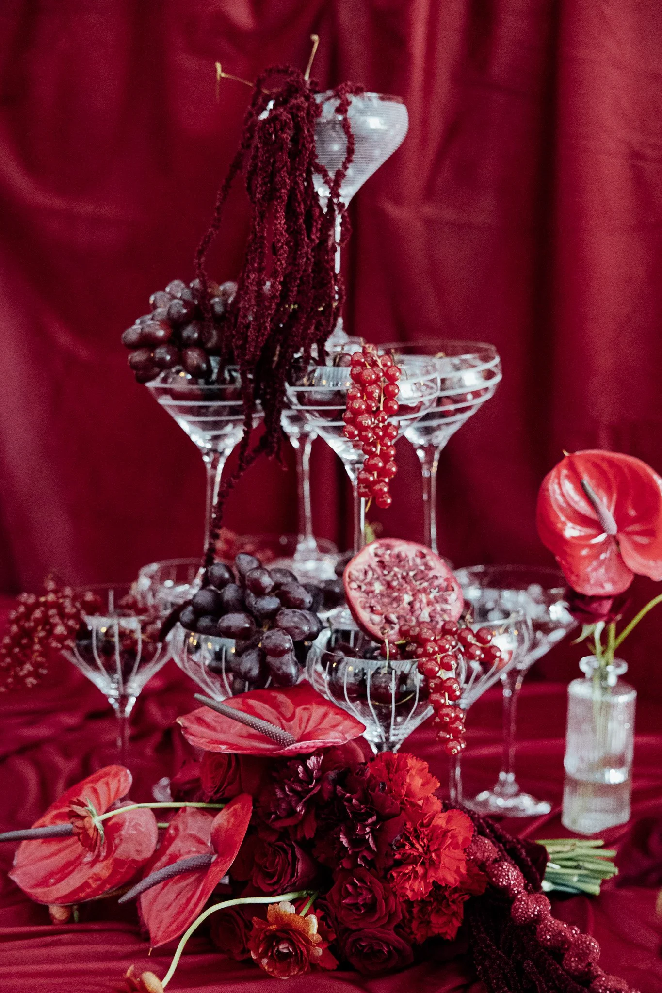 Luxury red tablescape styling with glassware and florals for a Byre Barn Kent wedding