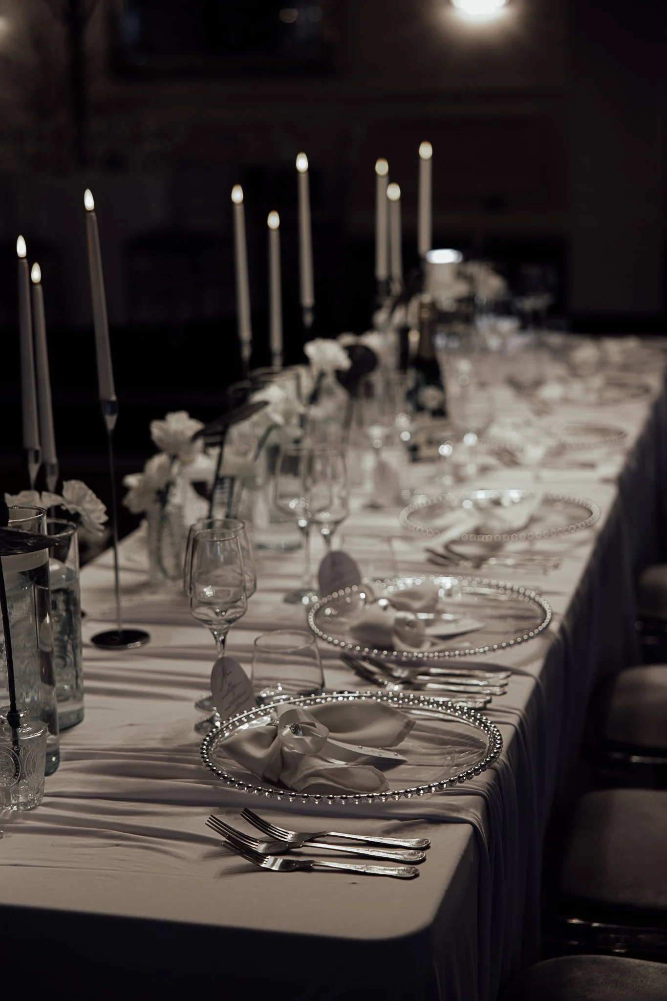 Long wedding table styling with candles and neutral details from a styled shoot at The Orchard.