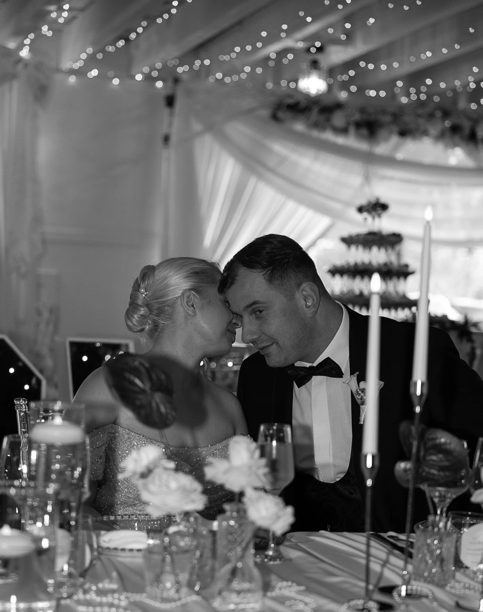 Black and white wedding reception moment capturing an intimate celebration atmosphere.