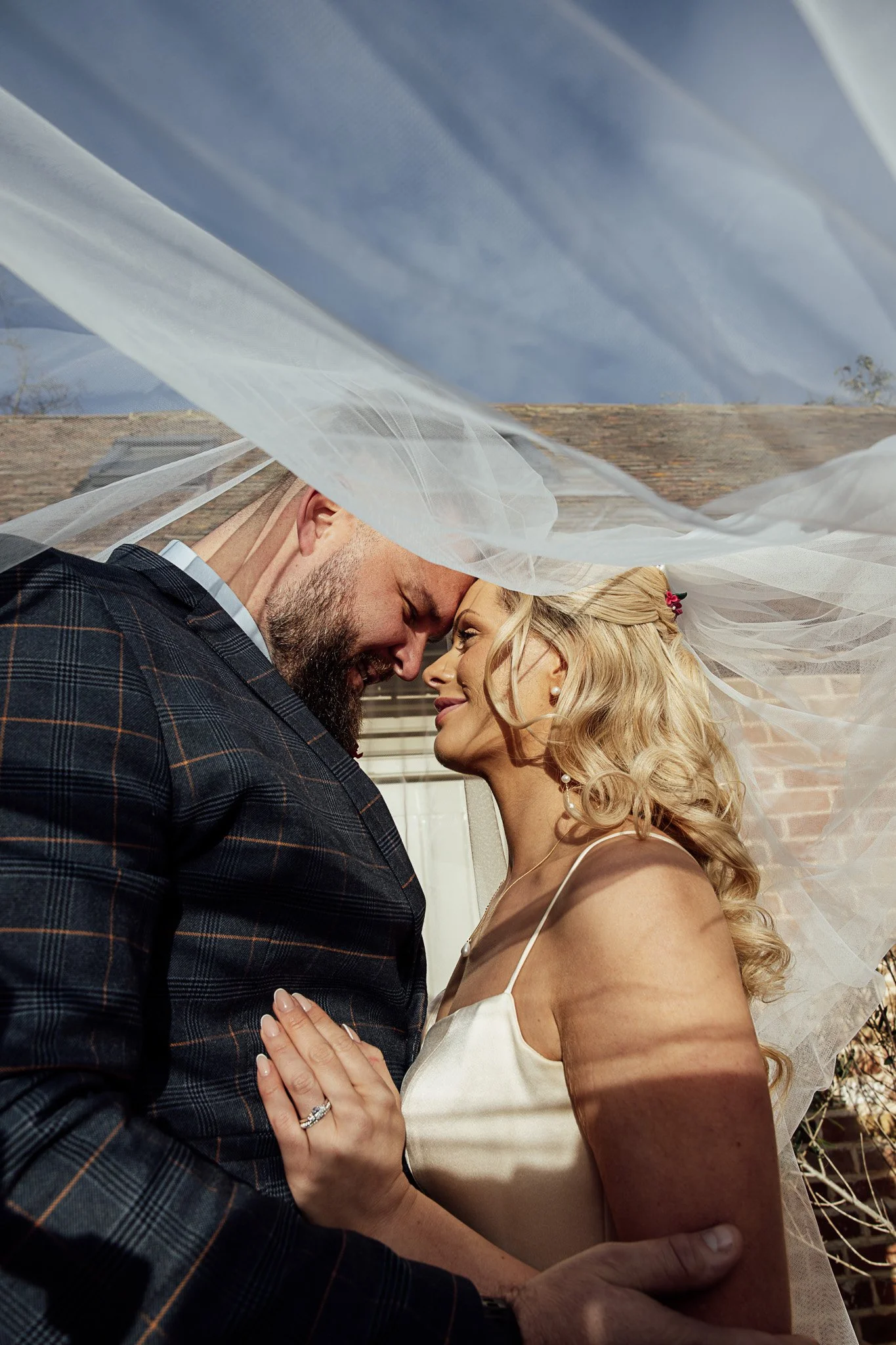 Bride and groom portrait beneath the veil at a romantic Byre Barn Kent wedding styled shoot