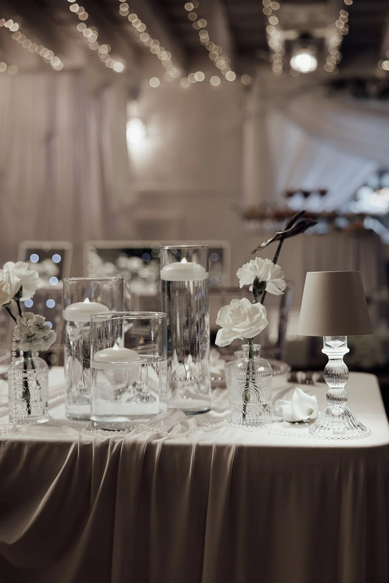Elegant wedding table styling with candles and glassware at The Orchard in Kent.

