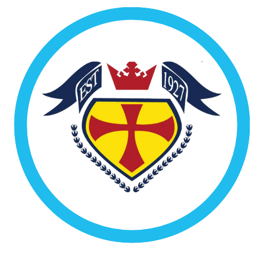 A crest with a shield featuring a red cross on a yellow background, topped with a red crown, and flanked by navy blue ribbons with 'EST' and '1927'.