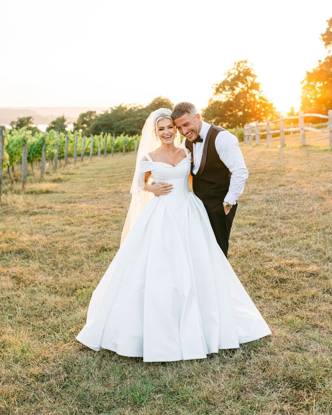 Golden hour in the vineyard with Charlotte & Shane from their incredible summer wedding at @lympstone_manor 
Looking forward to sharing more from this dream day. 🤍
Planner & stylist @lauralouisehallweddings
Photographer @tarastattonphotogr