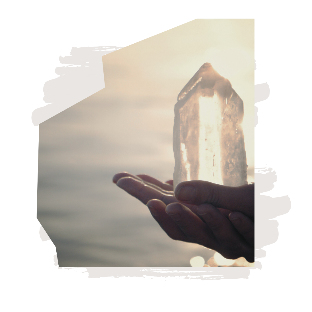 Crystals symbolizing a healing practitioner at Woodstock Healing Arts channeling energy with light touch to balance the body's energy flow and promote deep relaxation.
