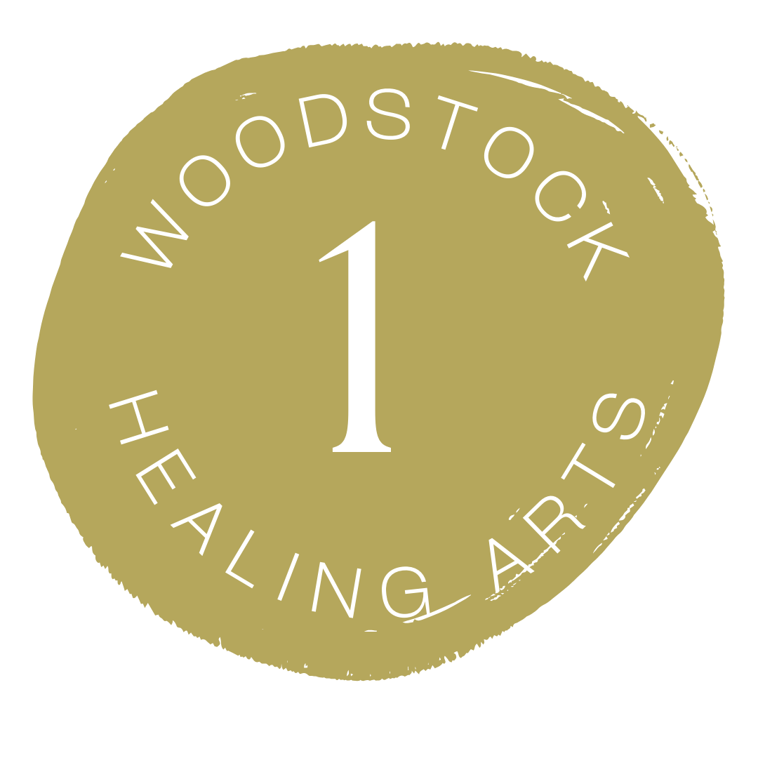 A circular logo for 'Woodstock Healing Arts' with a gold background and white text, featuring the number 1 in the center.