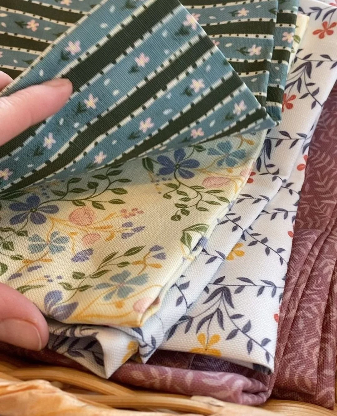 Sewing a bunch of dinner napkins from leftover fabric to sell at markets this fall. I think I finally mastered mitered corners. 👏
