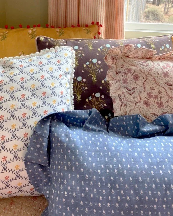 More pillows - some with ruffles, some with velvet piping, some with crochet lace and some with red pom poms.