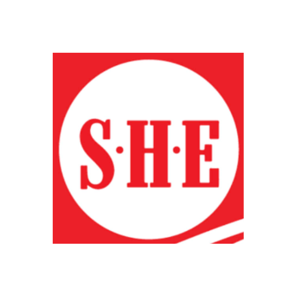A red and white circular logo with the letters 'S', 'H', and 'E' separated by dots, with a red background and a curved white stripe at the bottom.