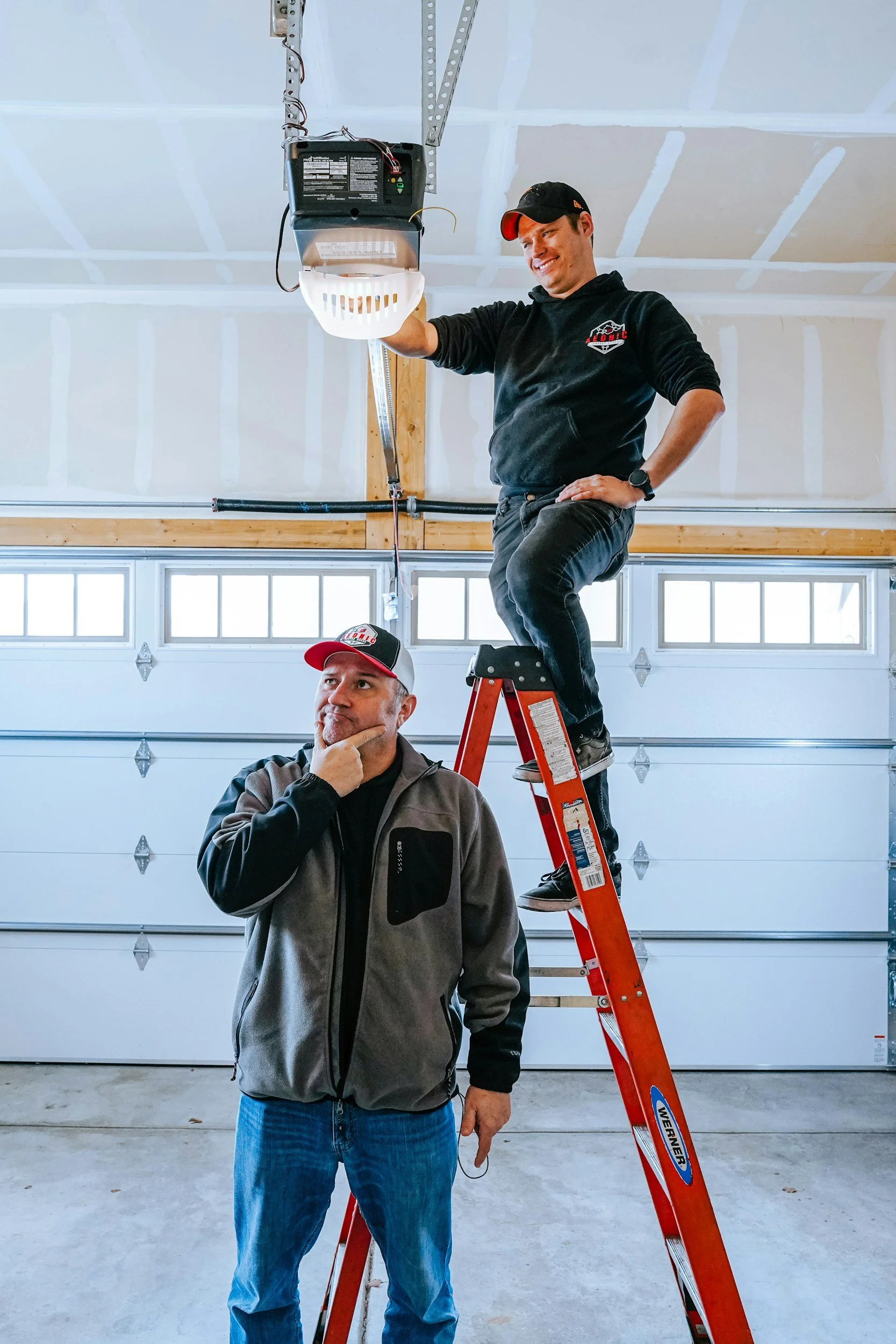 two men installing light