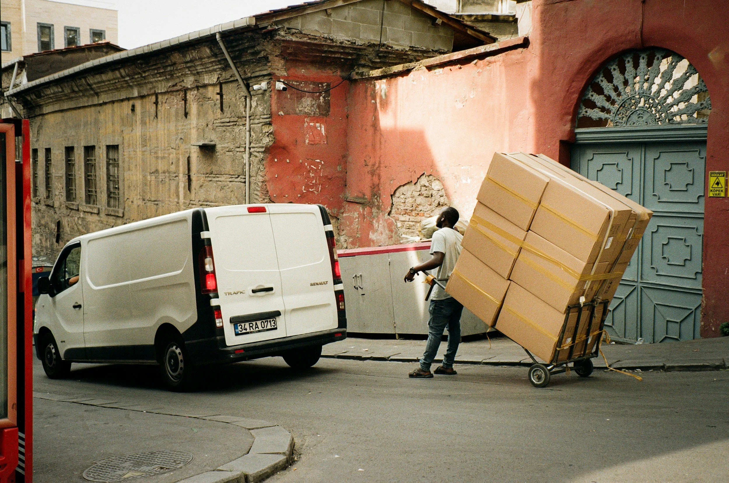 man with boxes and assisting to move