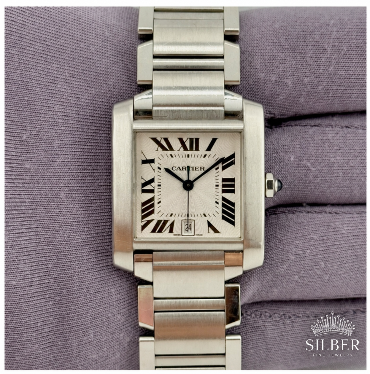 Cartier watch on lavender fabric.png