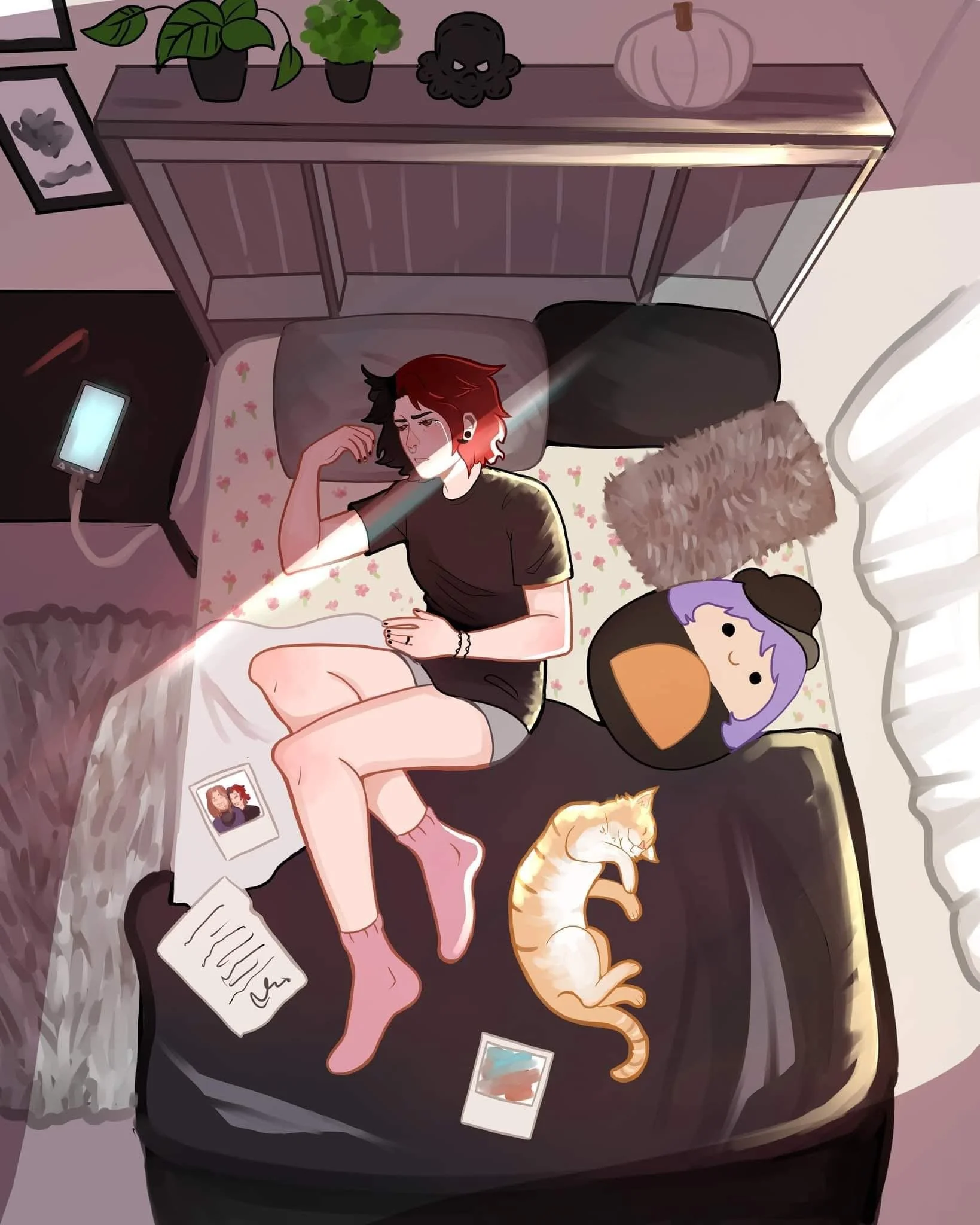 A person with black and red hair lying on a bed, with a cat sleeping nearby, a plush doll, and family photos around. Sunlight streams through a window, creating a cozy atmosphere.