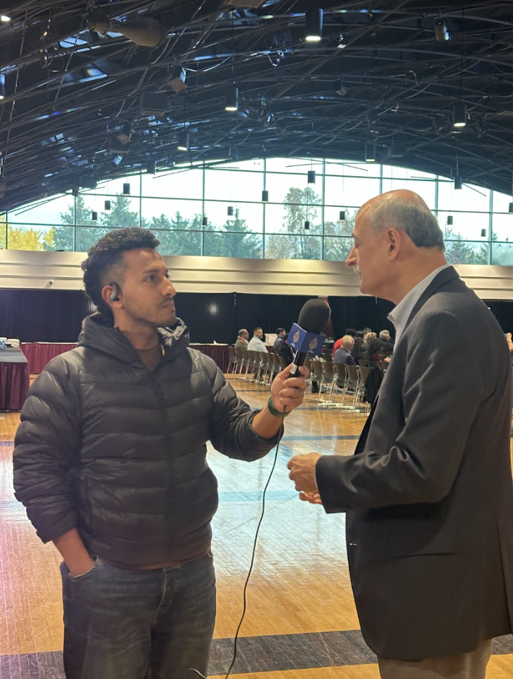 Pictured (left to right): Amr Hassan Sayed, Aljazeera Mubasher journalist, interviewing Warren David, cofounder of Arab America Foundation