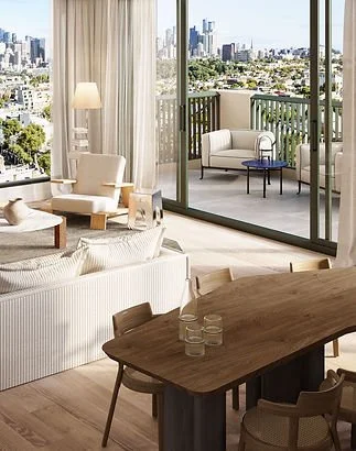 Living room with beige furniture, a wooden dining table with glasses, and a balcony with outdoor seating and city view.