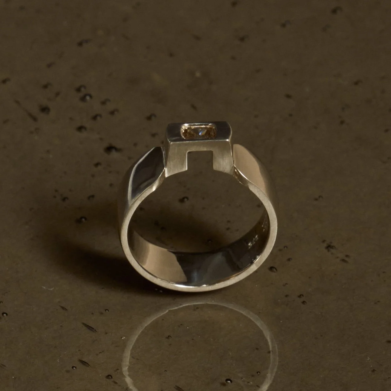 Threshold contoured ring with cushion cut brown diamond
