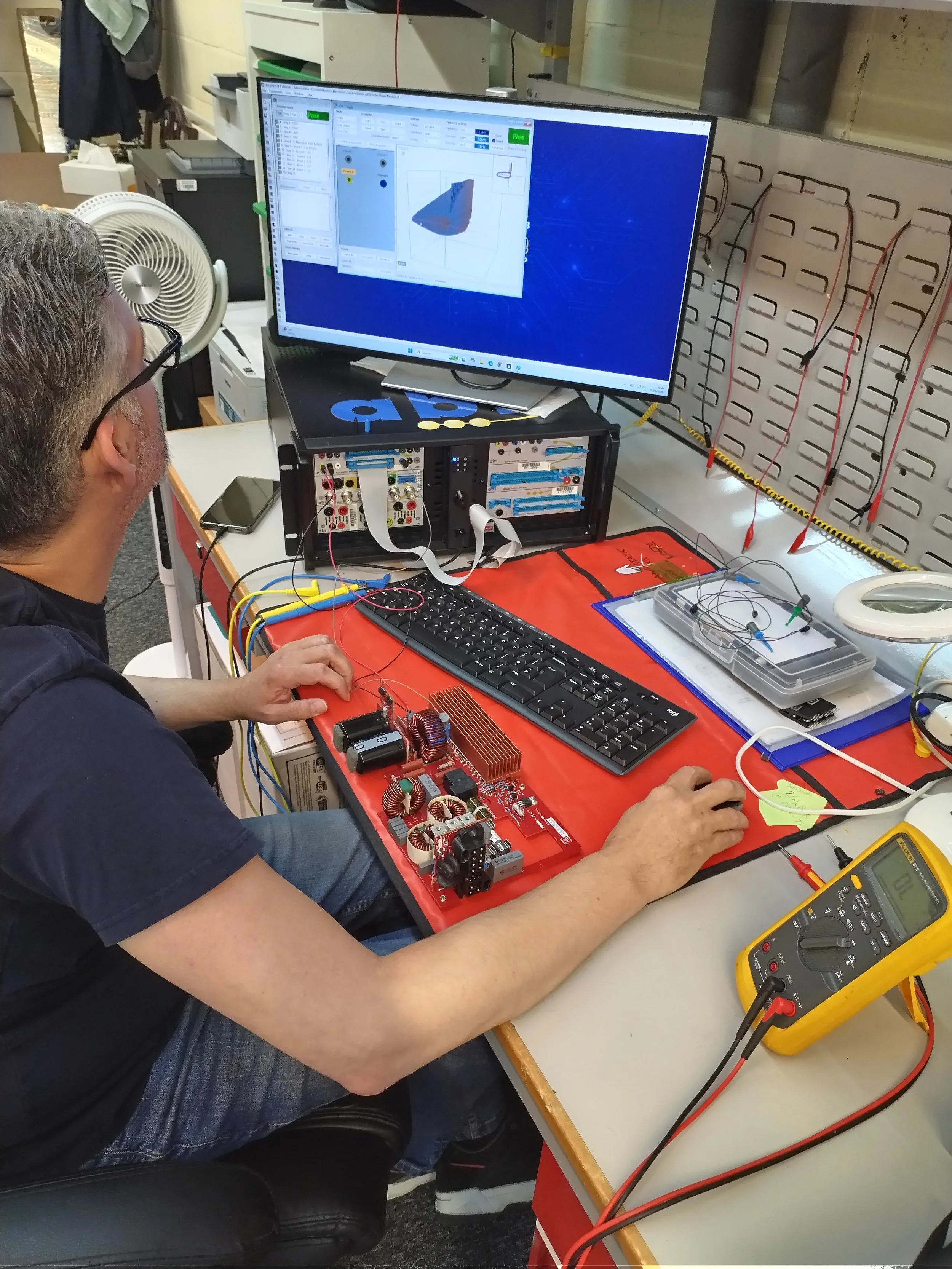 Engineer using ABI BoardMaster in-circuit test system to diagnose industrial circuit board faults at Northern Power Electronics Newcastle"