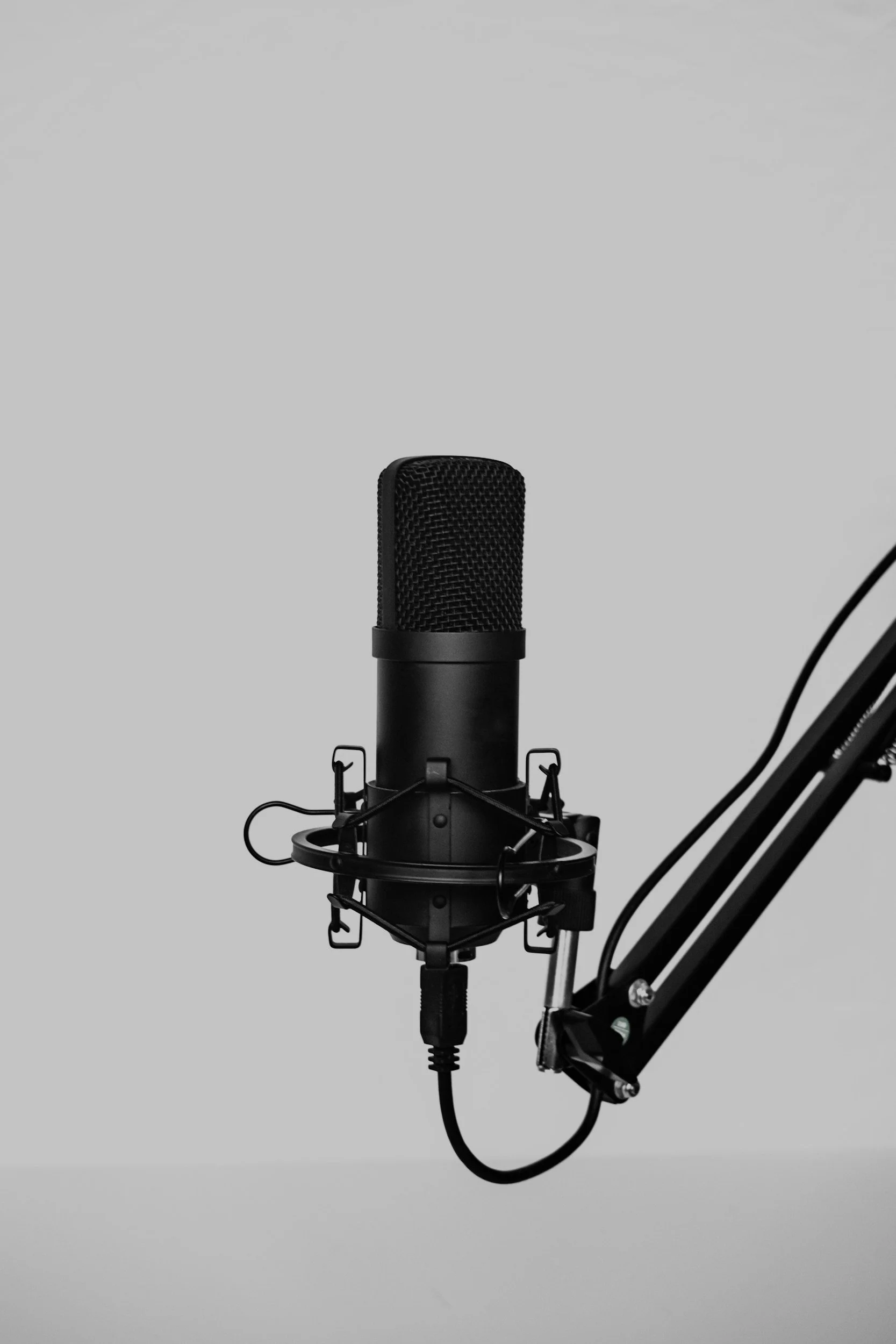 Studio microphone representing professional webinar design and delivery.