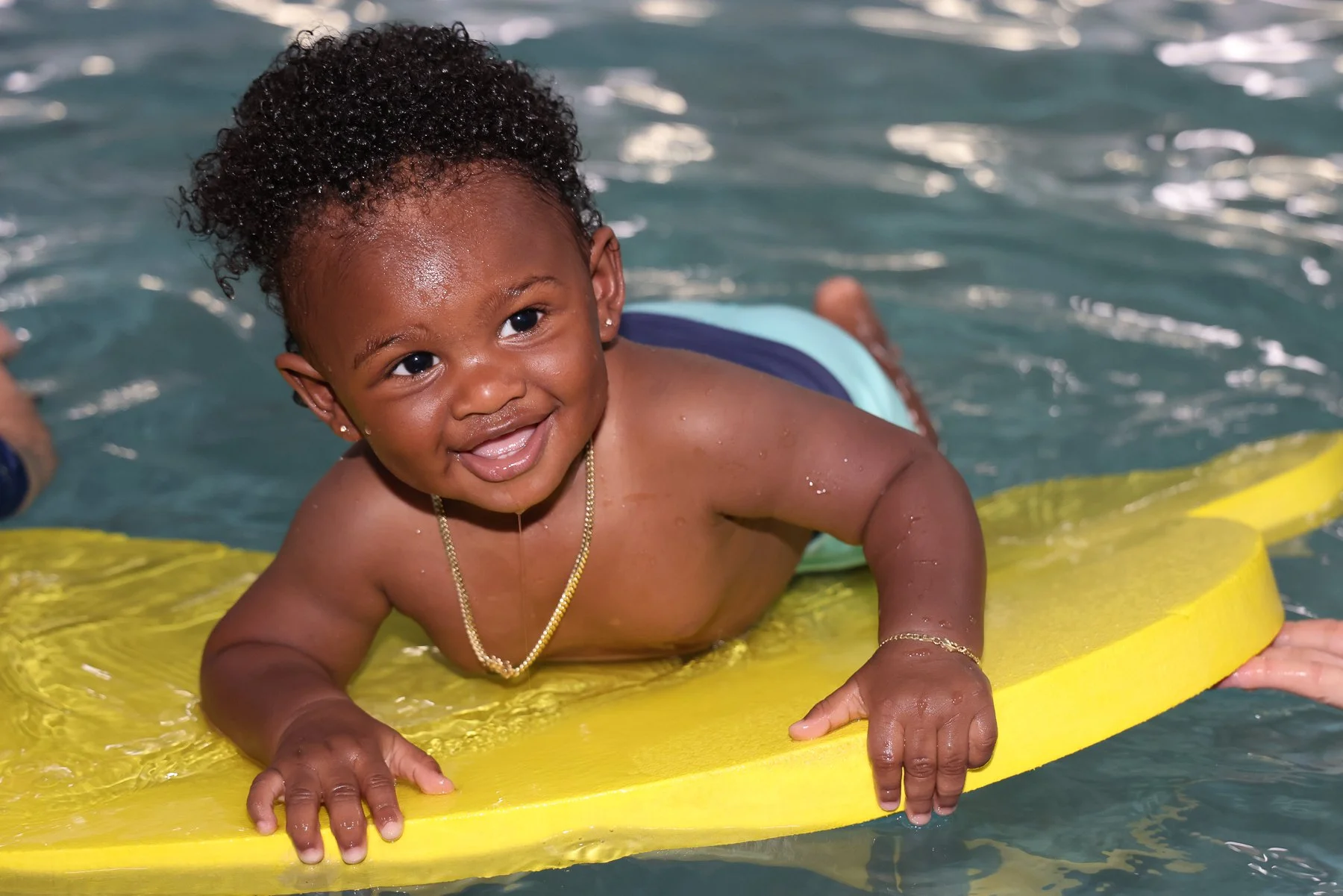 A child participating in a swim lesson