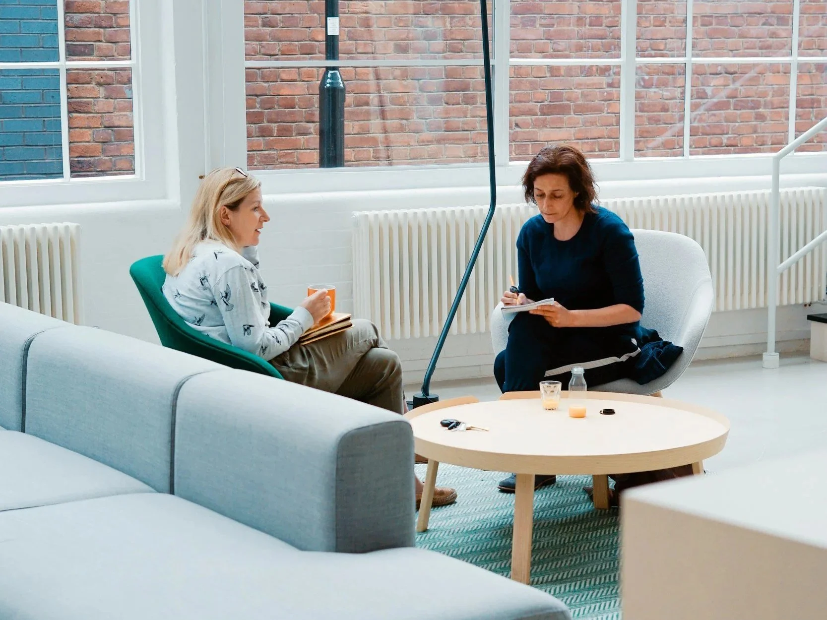 Two people facing each other having a discussion