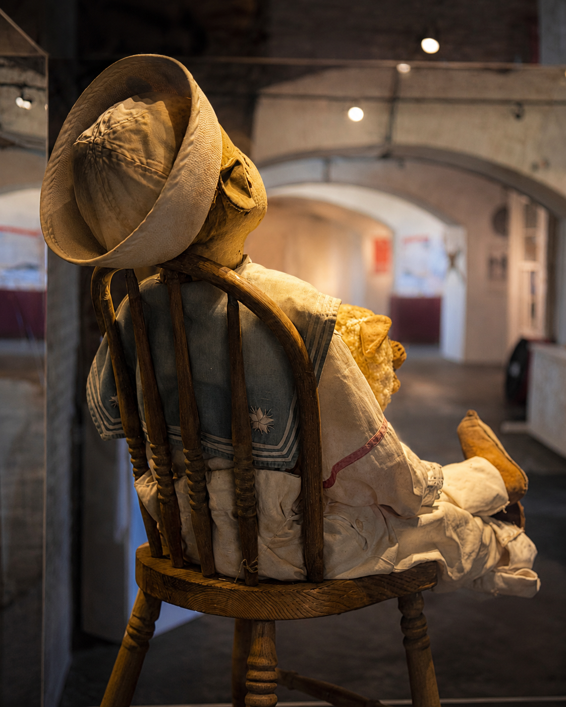 Robert the Doll seated in his display case at Fort East Martello Museum in Key West