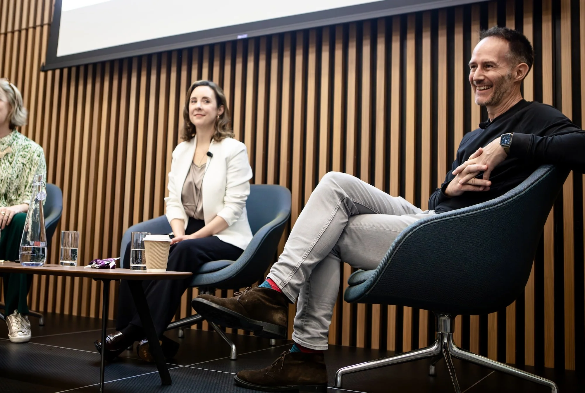 Panel discussion at Re:work Live event with a man and two women