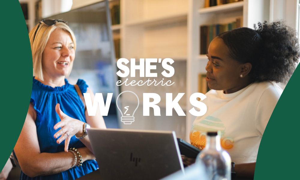 She's Electric Works event logo overlaid on women with laptop